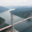 11月29日，航拍实现合龙的红水河特大桥。当日，由黔桂两省区合作共建的世界首座非对称混合式叠合梁斜拉桥——银川至龙邦公路贵州境惠水至罗甸（黔桂界）高速公路红水河特大桥实现合龙，桥梁全长956米，塔高195.1米。大桥的合龙标志着从北部银川起点，贯穿中国宁夏、甘肃、四川、贵州至广西龙邦口岸等五省银百高速（G69）惠水至罗甸段即将全面建成通车。 中新社记者 贺俊怡 摄 - 贵州新闻